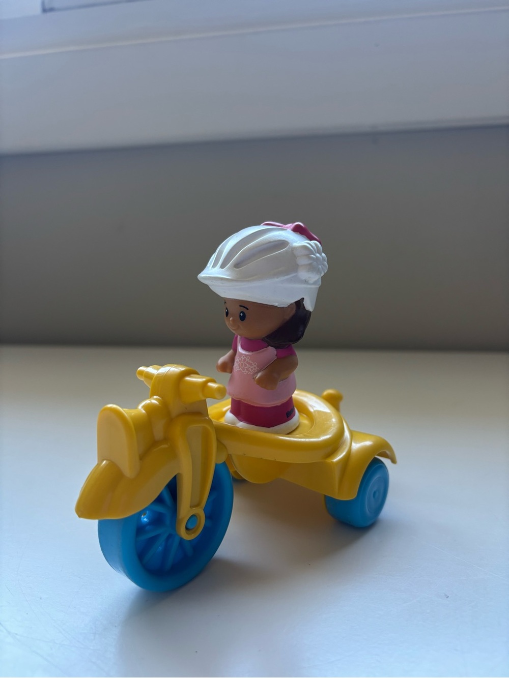 Fisher price little people MIA with yellow tricycle